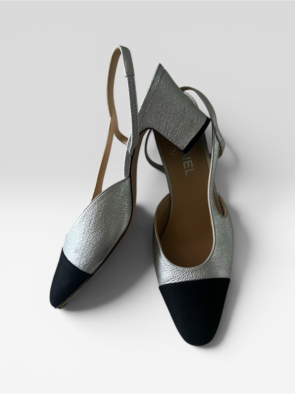 CHANEL Silver Textured Leather Slingback Pumps with Black Cap Toe